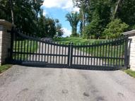 Steel driveway gate to look like wood