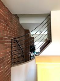 curved rail to follow stair stringer