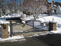 UP HILL SWING DRIVEWAY GATE