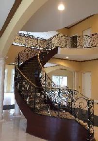 Curved stair rail modified scrolls award winning job